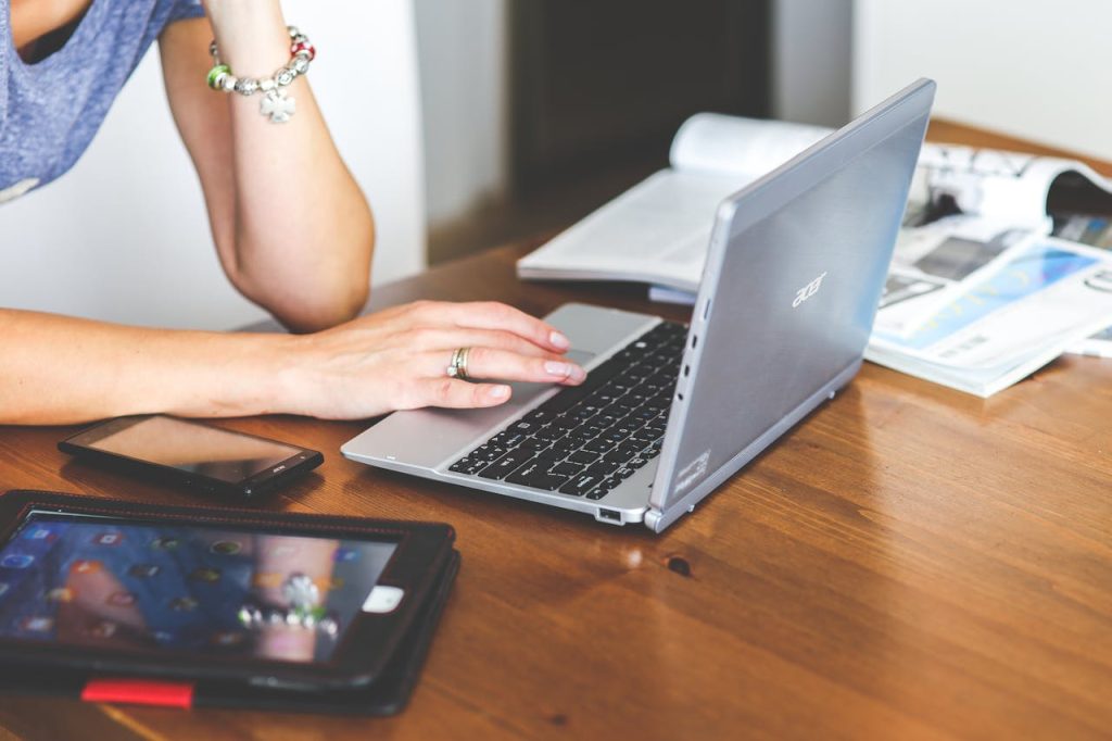 woman hand smartphone laptop.jpg